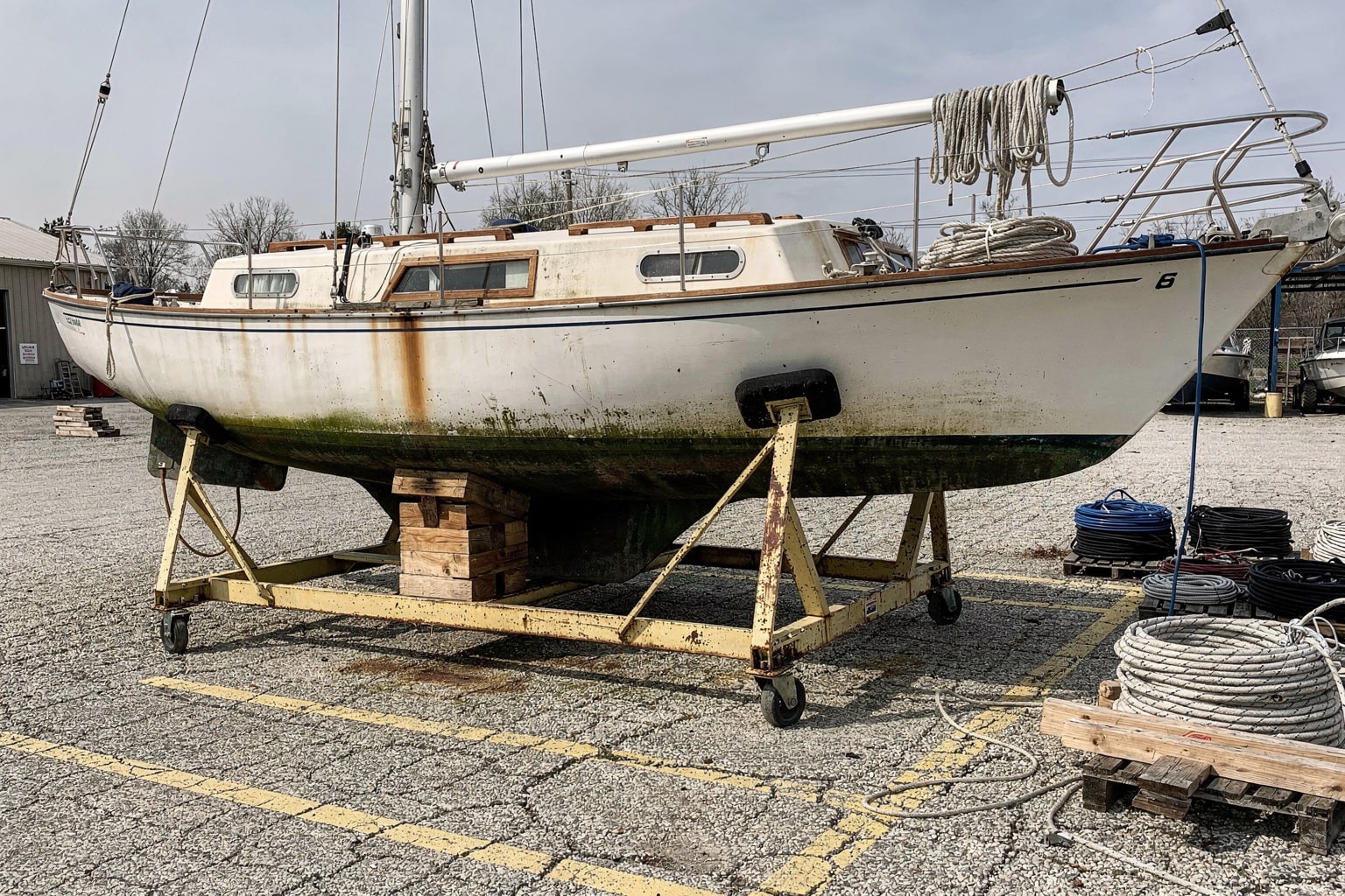 Junk boat removal Columbus Ohio commercial boatyard storage cradle disposal