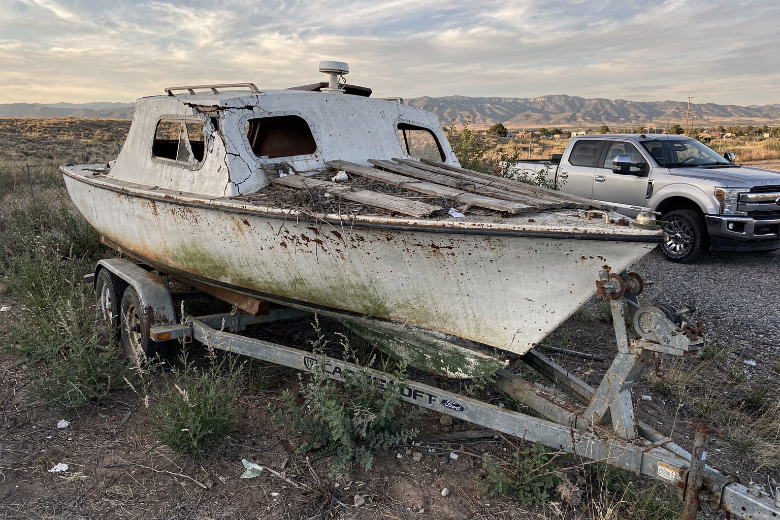 Junk boat removal from abandoned Colorado property disposal service