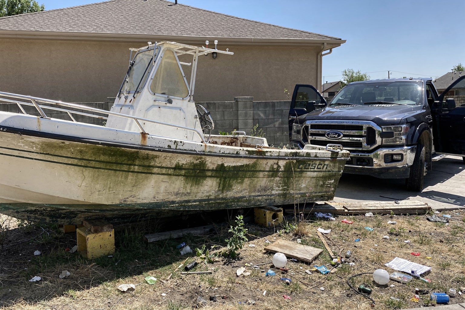 Multiple boat types ready for junk boat removal and disposal Aurora Colorado