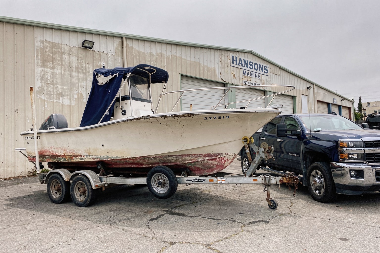 Commercial boat removal and disposal Los Angeles warehouse lot with dumpster