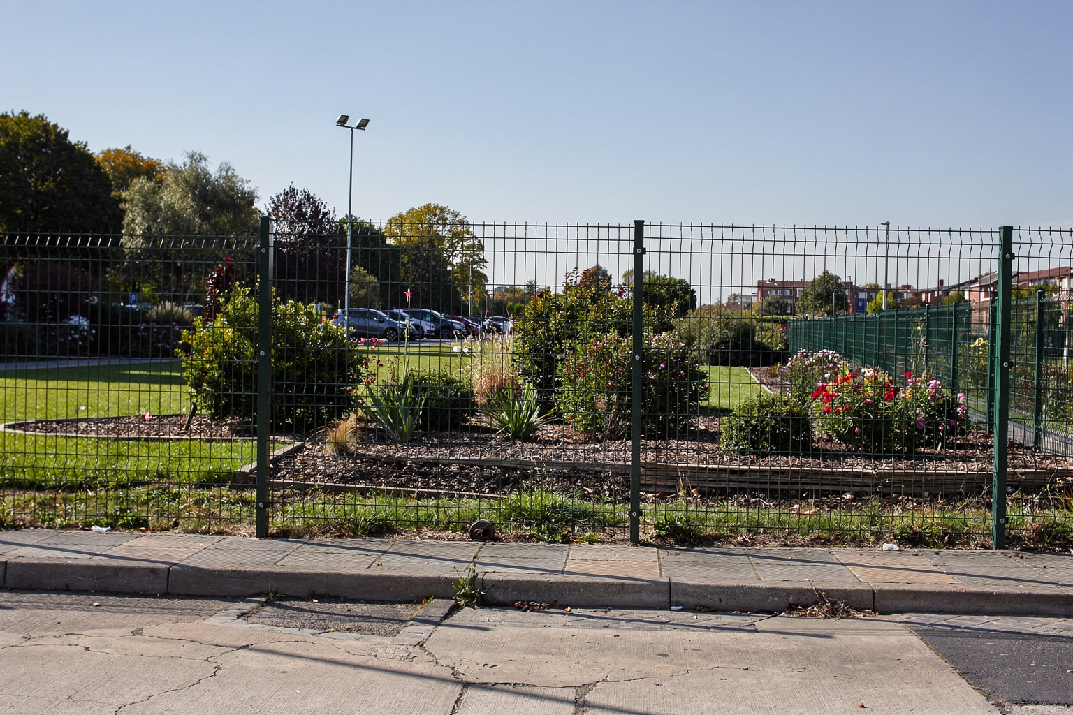 large sailboat on steel cradle in Missouri boatyard with travel-lift and workshop, professional marine salvage operation