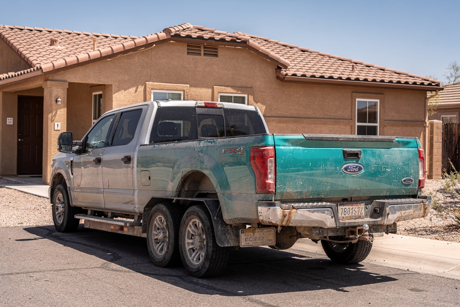 Junk boat removal in Tucson with aluminum fishing boat loaded on trailer, ready for hauling away