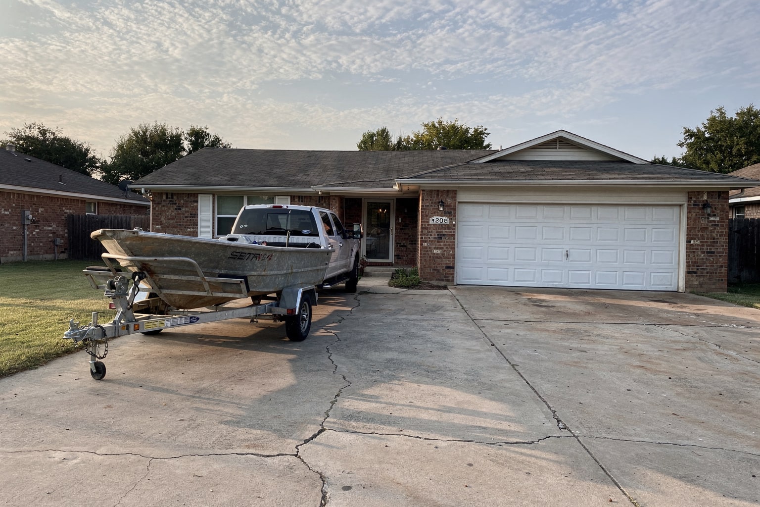 Junk boat removal Oklahoma City residential driveway truck trailer pickup