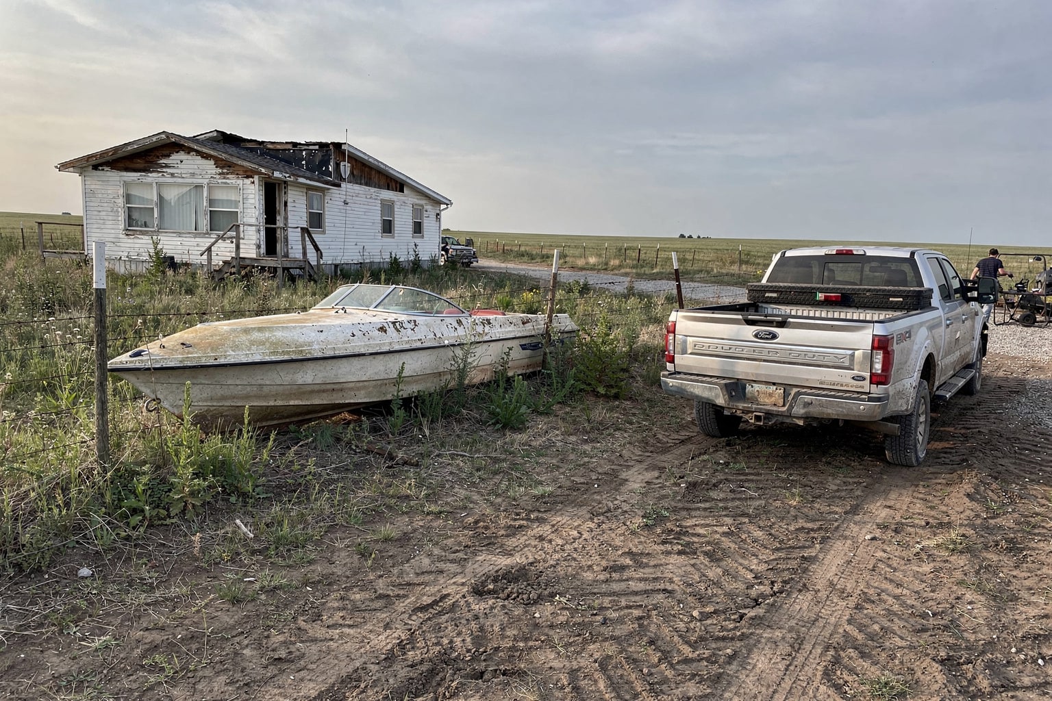 Abandoned junk boat removal North Dakota overgrown property salvage operation preparation