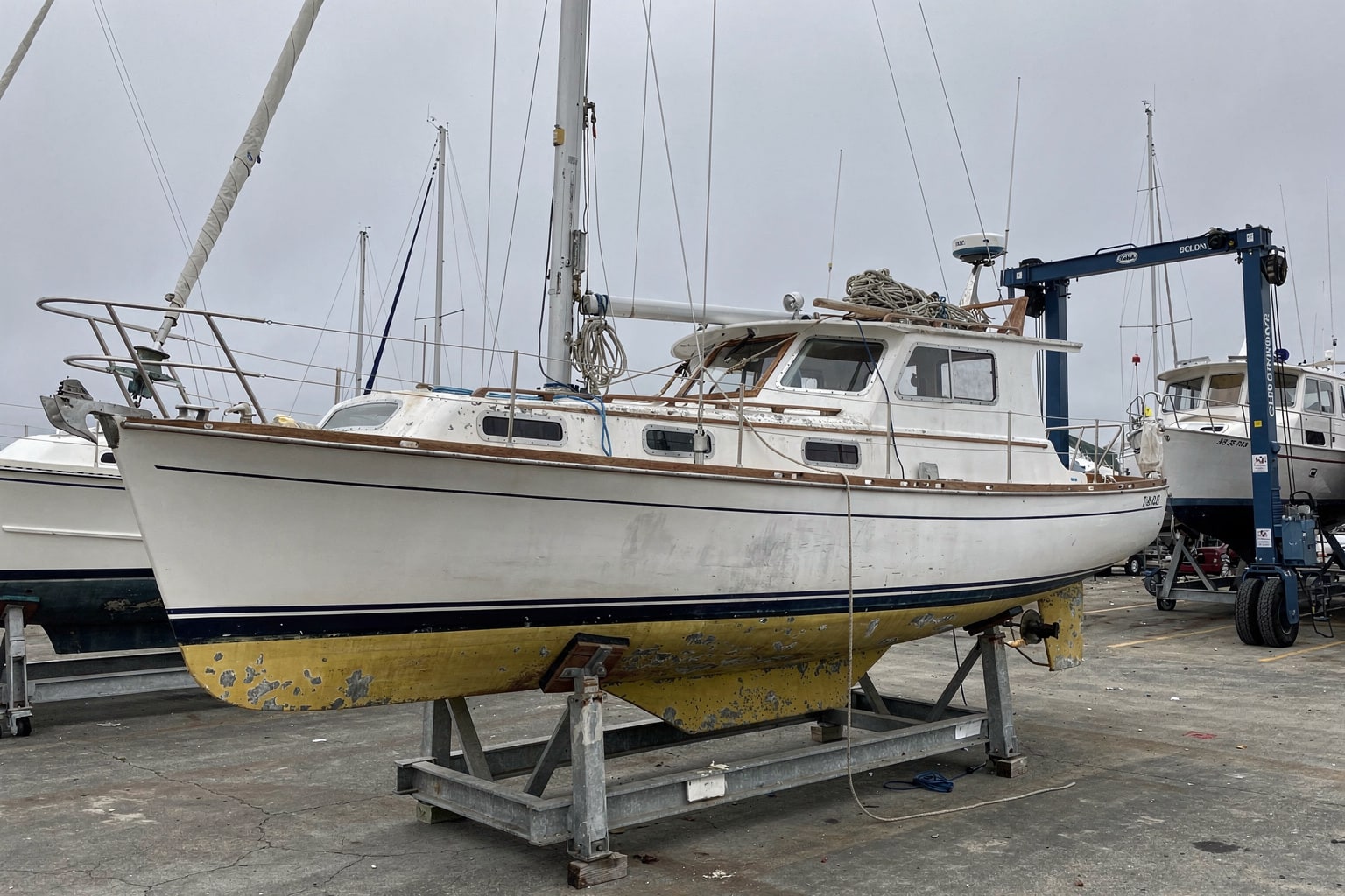 28-foot sailboat junk boat removal on cradle at San Francisco boatyard for disposal